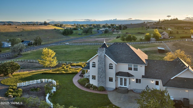 bird's eye view featuring a mountain view and a rural view