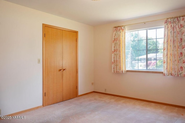3606 Richey Rd, Yakima, WA 98902 - unfurnished bedroom with light colored carpet, a closet, and baseboards