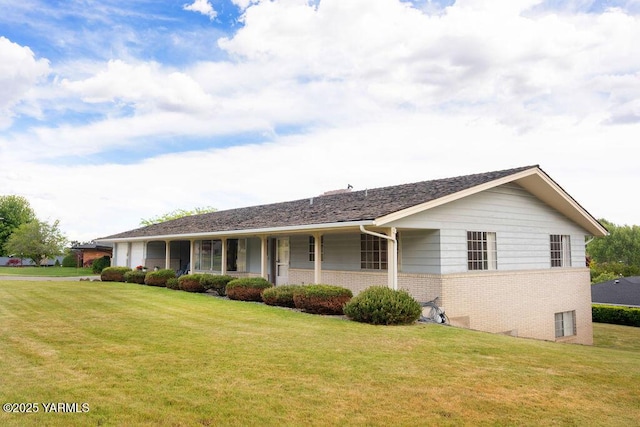 3606 Richey Rd, Yakima, WA 98902 - ranch-style home with brick siding, a front lawn, and an attached garage