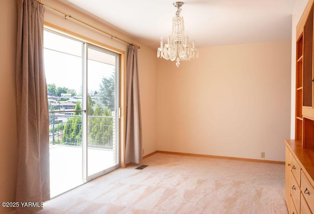 3606 Richey Rd, Yakima, WA 98902 - unfurnished dining area with a chandelier, light colored carpet, and baseboards