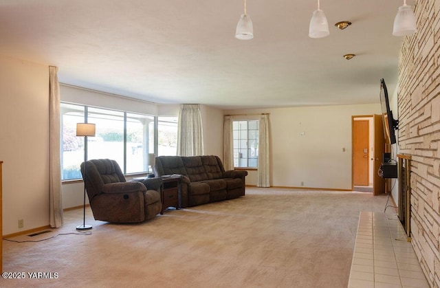 3606 Richey Rd, Yakima, WA 98902 - living area with a stone fireplace, light carpet, and baseboards