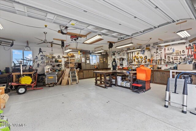 3501 S 40th Ave, Yakima, WA 98903 - garage with a workshop area and a ceiling fan