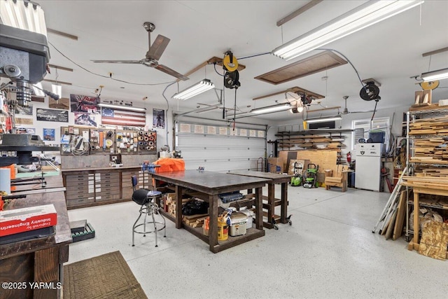 3501 S 40th Ave, Yakima, WA 98903 - garage featuring a workshop area, a ceiling fan, and a garage door opener