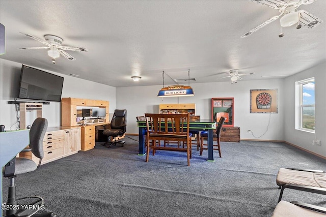 3501 S 40th Ave, Yakima, WA 98903 - dining room featuring ceiling fan, dark carpet, a desk, and baseboards
