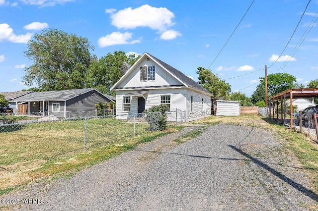1713 S 10th Ave, Yakima, WA 98902 - view of front facade with board and batten siding and driveway
