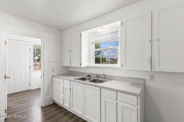 1713 S 10th Ave, Yakima, WA 98902 - kitchen featuring white cabinetry, light countertops, and dark wood-style floors
