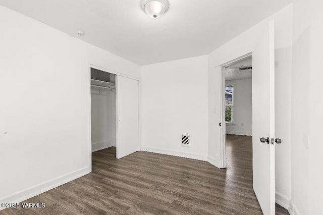 1713 S 10th Ave, Yakima, WA 98902 - unfurnished bedroom with dark wood finished floors and a closet