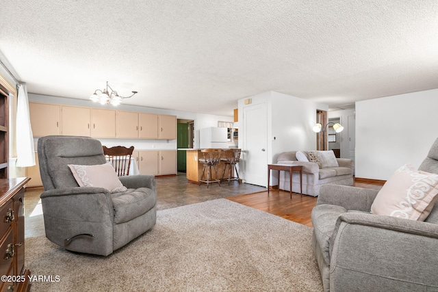 112 N 53rd Ave, Yakima, WA 98908 - living room featuring a chandelier, a textured ceiling, and wood finished floors