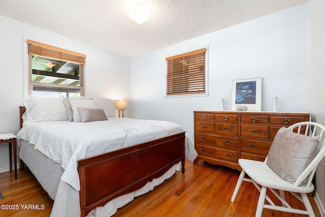 112 N 53rd Ave, Yakima, WA 98908 - bedroom with wood finished floors and a textured ceiling