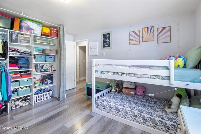 bedroom with wood finished floors