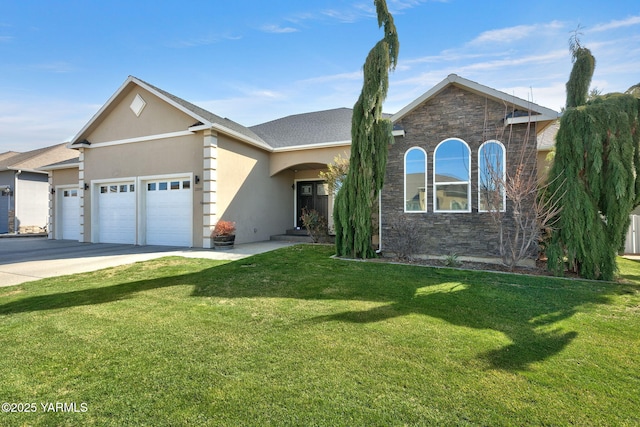 view of front of property featuring stone siding, an attached garage, stucco siding, and a front yard