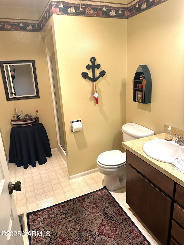 full bath with visible vents, toilet, a stall shower, vanity, and baseboards