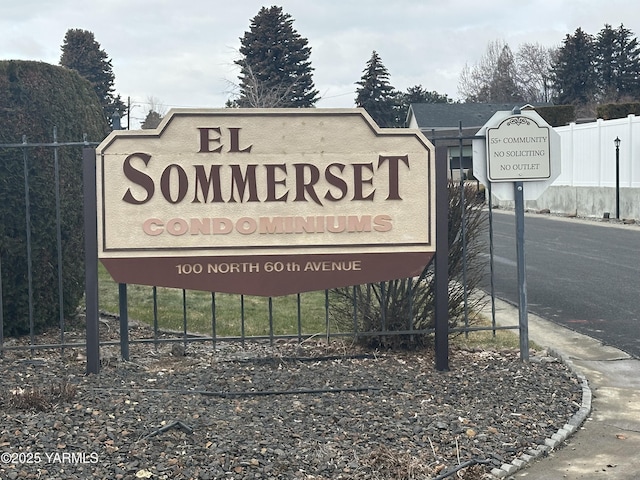 community sign with fence