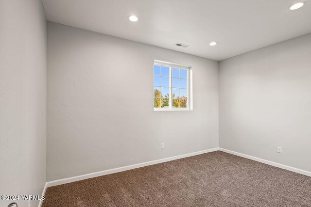 spare room featuring baseboards, carpet, visible vents, and recessed lighting