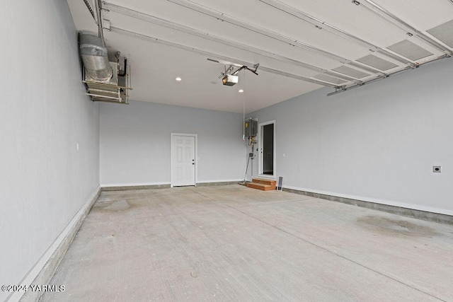 garage with baseboards and a garage door opener