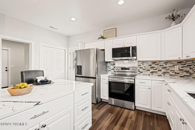 kitchen with white cabinetry, visible vents, and appliances with stainless steel finishes