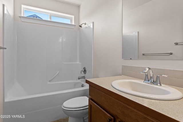 bathroom featuring vanity, toilet, and bathtub / shower combination