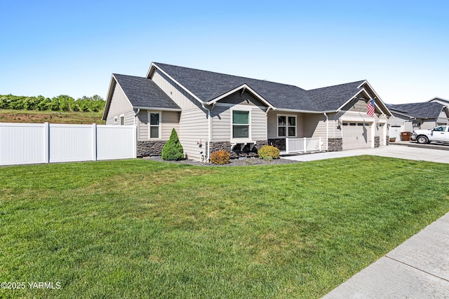 view of front facade featuring stone siding, driveway, a garage, covered porch, and a shingled roof