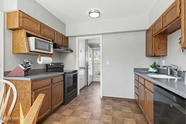 702 S 31st Ave, Yakima, WA 98902 - kitchen featuring electric range oven, dishwashing machine, white microwave, under cabinet range hood, and dark countertops