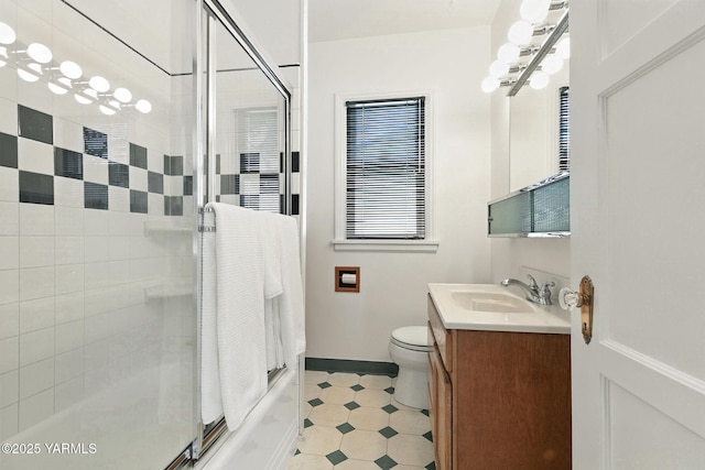 702 S 31st Ave, Yakima, WA 98902 - full bath with vanity, tile patterned floors, and shower / bath combination with glass door