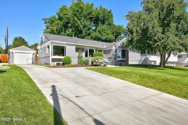 702 S 31st Ave, Yakima, WA 98902 - single story home with an outbuilding, a garage, a front yard, and a shingled roof
