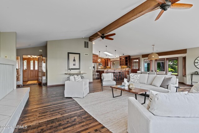 living room featuring dark wood-style floors, beam ceiling, visible vents, and baseboards