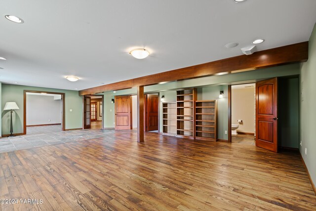 interior space with light wood-type flooring, baseboards, and recessed lighting