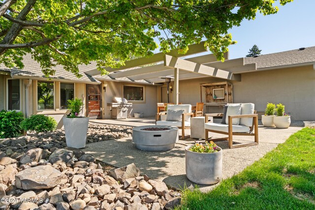 view of patio featuring a pergola, a fire pit, and grilling area