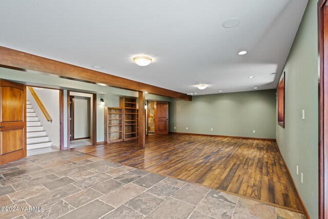 unfurnished room with recessed lighting, baseboards, stairway, and stone tile floors