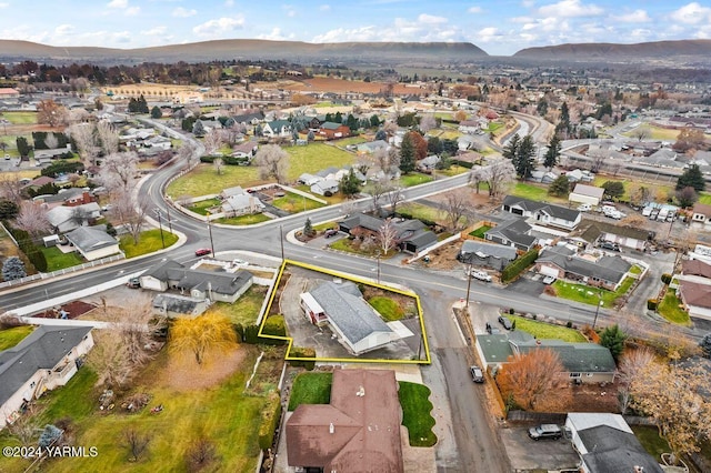 drone / aerial view featuring a mountain view and a residential view