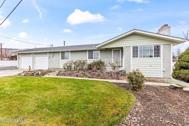 single story home featuring driveway, a front lawn, a chimney, and an attached garage