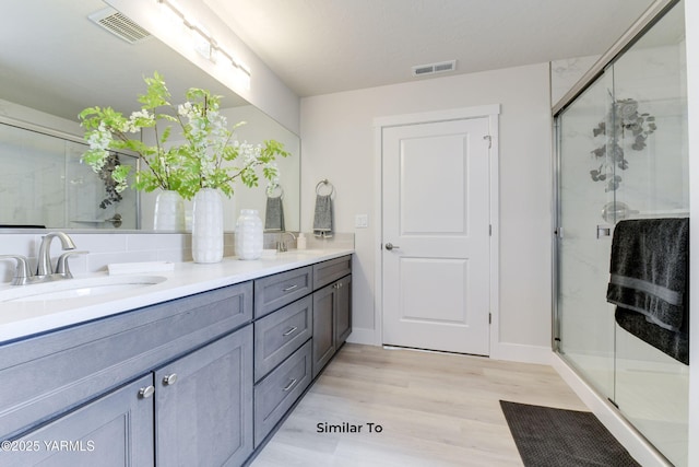 607 Vineyard Street (Phase 2Lot 25) Spec, Grandview, WA 98930 - full bath featuring double vanity, wood finished floors, a shower stall, and baseboards