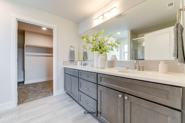 607 Vineyard Street (Phase 2Lot 25) Spec, Grandview, WA 98930 - full bath with double vanity, wood finished floors, a shower stall, a walk in closet, and baseboards