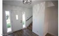 foyer entrance with dark wood-type flooring