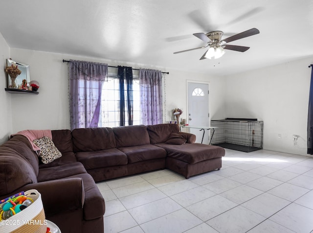 living room with light tile patterned floors and a ceiling fan