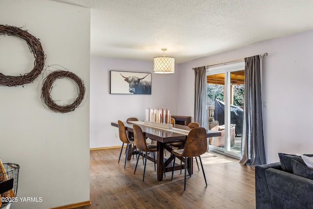 607 N 53rd Ave, Yakima, WA 98908 - dining space with wood finished floors and a textured ceiling