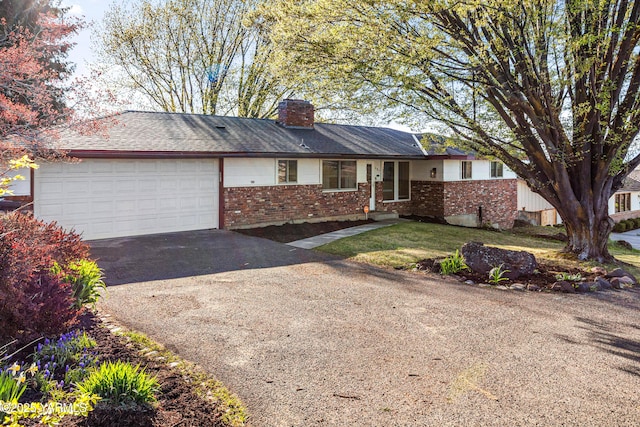 607 N 53rd Ave, Yakima, WA 98908 - single story home featuring brick siding, driveway, a garage, and a chimney