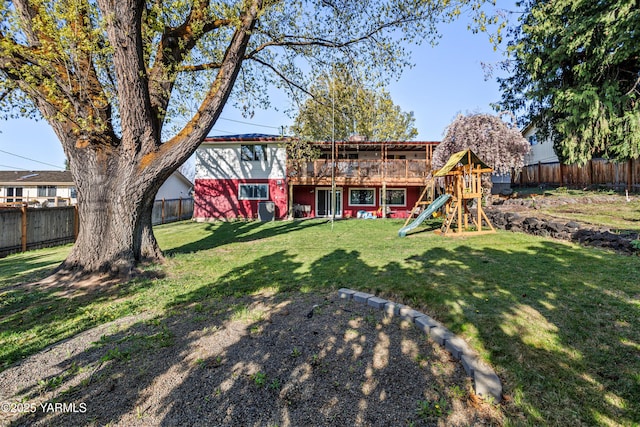 607 N 53rd Ave, Yakima, WA 98908 - fenced backyard with a playground and a wooden deck