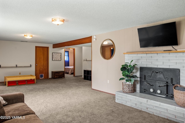 607 N 53rd Ave, Yakima, WA 98908 - carpeted living area with a fireplace and a textured ceiling