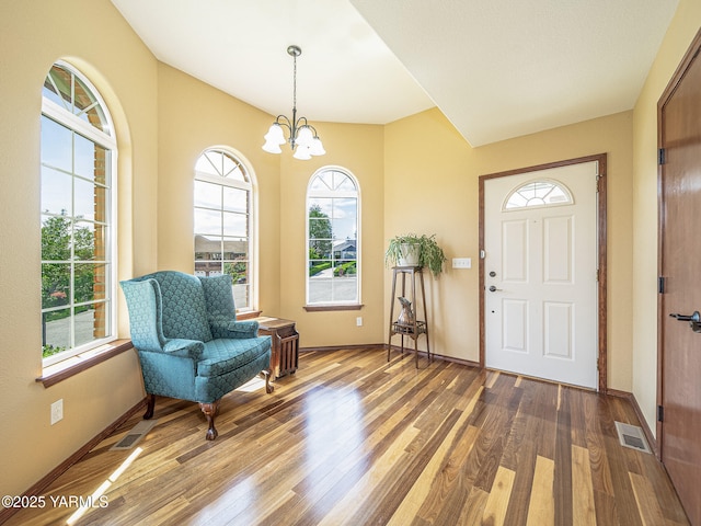 9203 W Yakima Ct, Yakima, WA 98908 - foyer entrance with wood finished floors, a chandelier, and baseboards