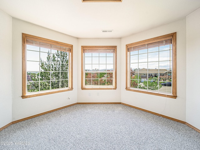 9203 W Yakima Ct, Yakima, WA 98908 - empty room featuring healthy amount of natural light, carpet, and baseboards
