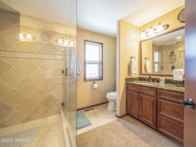9203 W Yakima Ct, Yakima, WA 98908 - full bathroom with tiled shower, vanity, toilet, and baseboards