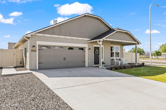 2300 S 57th Ave, Yakima, WA 98903 - view of front of property with an attached garage, driveway, covered porch, and a gate