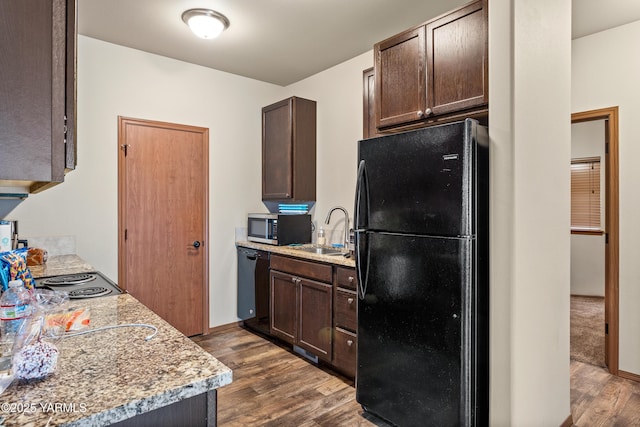 3103 Swan Ave, Yakima, WA 98902 - kitchen featuring black appliances, a sink, dark wood-style flooring, dark brown cabinetry, and light countertops