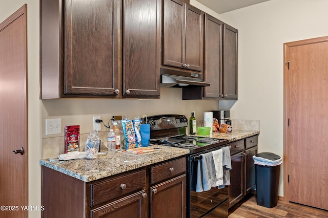 3103 Swan Ave, Yakima, WA 98902 - kitchen featuring black range with electric stovetop, under cabinet range hood, dark brown cabinets, and wood finished floors