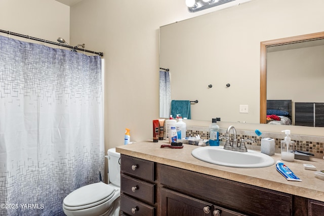 3103 Swan Ave, Yakima, WA 98902 - ensuite bathroom with toilet, vanity, backsplash, and curtained shower