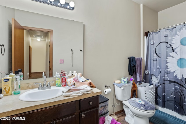 3103 Swan Ave, Yakima, WA 98902 - bathroom featuring vanity, toilet, a shower with curtain, and wood finished floors