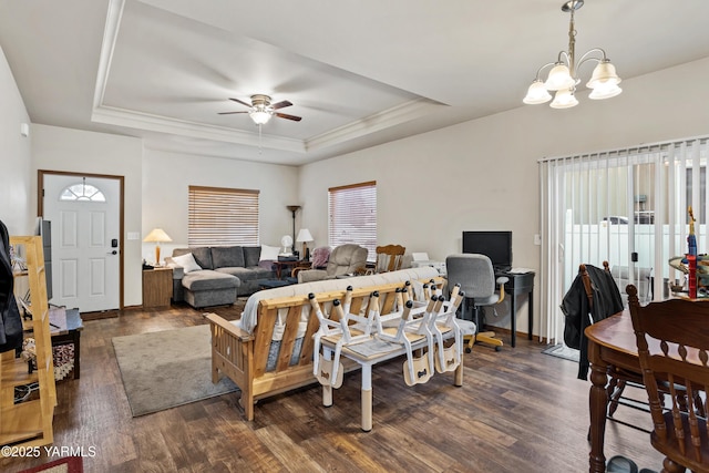 3103 Swan Ave, Yakima, WA 98902 - living area with a raised ceiling, a ceiling fan, dark wood finished floors, a chandelier, and crown molding