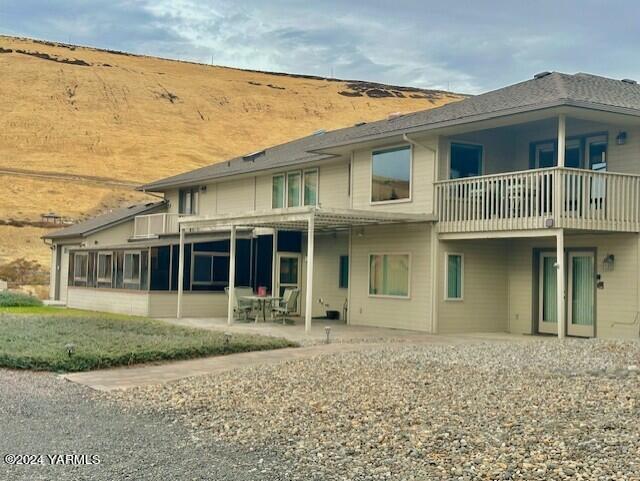 rear view of property featuring a patio