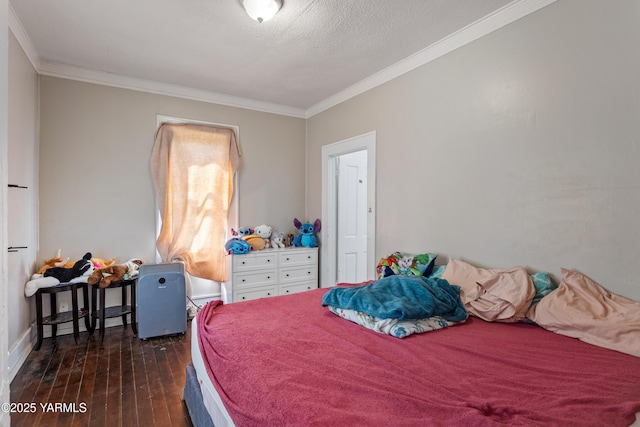 204 S 8th St, Yakima, WA 98901 - bedroom featuring crown molding, dark wood finished floors, and a textured ceiling